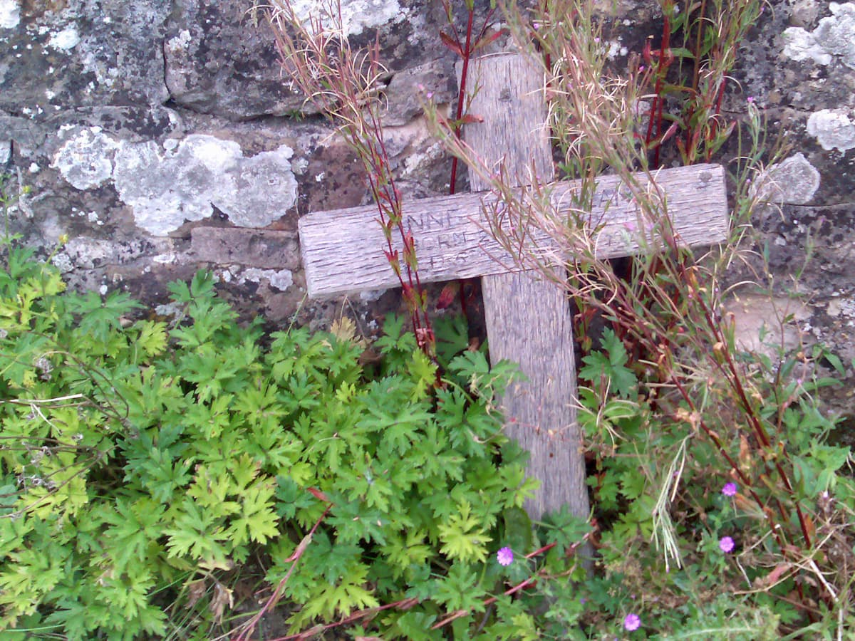The church is old, of course, and so the gravestones are too, a lot of people dying as children, and whole families, including, in at least one case, the second wife.  But I particularly liked this simple wooden cross.