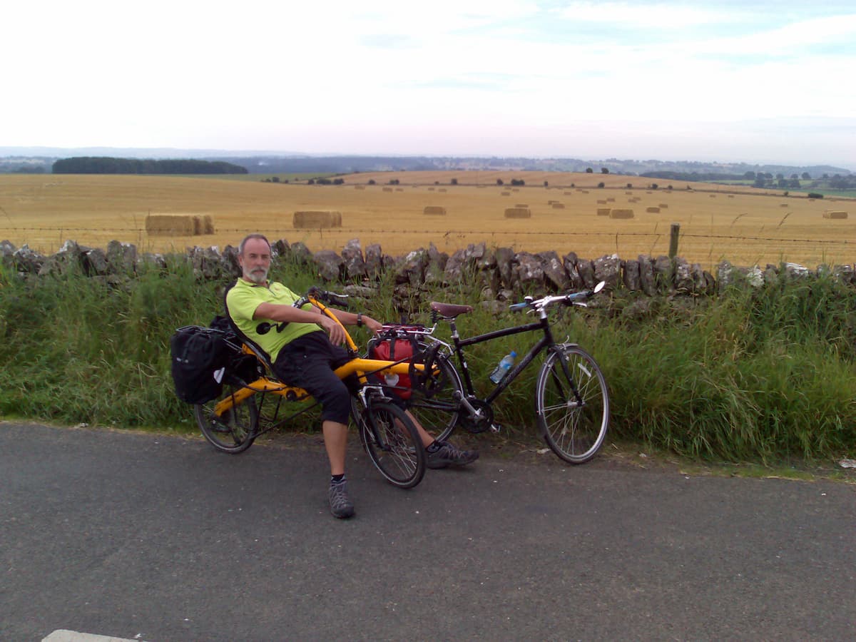 This is the same place as the previous photo, Pips decided to take a couple of me.  If you move your mouse over this thumbnail you'll get a rollover image that shows the very quiet road we'd cycled up.  <p>In fact, just as Pips had finished taking this photo a police car rolled by and slowed down, I don't know whether out of respect for the quietness or whether we looked suspicious.