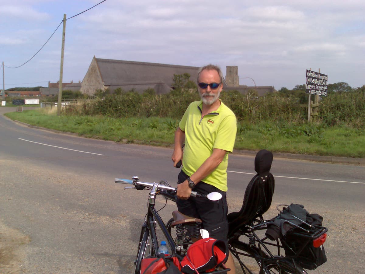 With me in the foreground of course, holding the bikes.<p>I really didn't take enough photos of this ride, which was very enjoyable.  The small lanes up to Sea Palling were very nice to ride on, then the B road down to Horsey was good too.  Not too many cars and yet wide enough for them to easily overtake but not so wide that they could slip past next to your elbow.<p>I didn't get to take any photos of me mending the puncture we had at Hickling nor of Howard the very nice man who invited us for a cup of tea when we'd finished.  Unfortunately having successfully mended the puncture the bloody valve broke and so I had to ride to get the car and come back for Pippa pushing her bike.