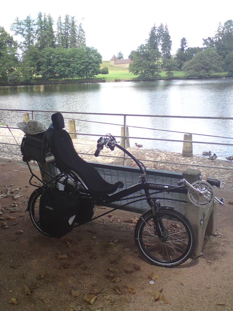 I stopped to put on sun cream, notice the sun hat on the back of the bike.  I also, luckily, double checked the map before riding back up the hill I'd come down - I didn't need to go back, this was the way on to Chateauneuf and Charlieu.<p>The road to Chateauneuf was just great: quite and lovely tarmac that meant I just flew and Chateauneuf was very, very pretty - with a nice looking Chambre d'hote on the outskirts of town, with a bridge and a river.  I'd flashed through and was just climbing up a steep hill when I thought to just ask a pedestrian to confirm this was the road to Charlieu.  Just as well I did because it wasn't, it seems I had just ridden, unnecessarily up a seriously steep hill.  Piss.  Still, the ride back down was fun.<p>I eventually got to Charlieu and found the campsite at the far end of town, I had a nice little plot, with spare plots nearby, in one of which I spent ages trying to hang my washing in a tree.<p>Dinner was fried egg, chips and frankfurters in the cafe at the campsite.  Very tasty, though hardly very French.