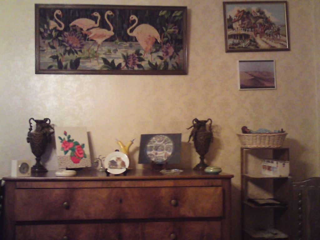 This was part of the decoration in my bedroom, a bizarre combination of the virgin mary with a clown mirror above. The mouse rollover shows a bit of my bedroom and if you click you'll see the wall opposite me at the breakfast table.