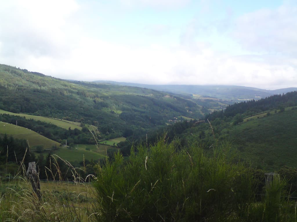 8.31am.  One thing about hills is that the views get better, this is of the valley I've been slowly hauling my'self out of.  I'd not had much chance to get fit before the ride started, largely because of a broken toe I'd managed to get 3 weeks before setting off.  So this was me getting fit.  Slowly.