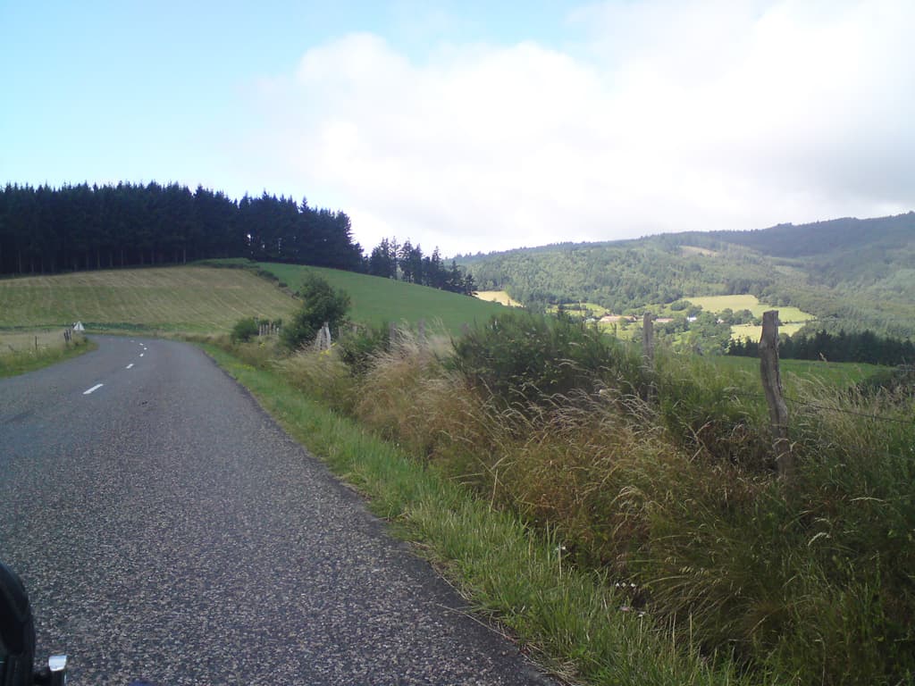 8.38am  Wow, what a lovely sight, the road going downhill.  The next hour or so was level or down.  I swooped into St Just-en-Chavalet and had croque monsieur and coffee for breakfast.<p>Actually, I'd stopped first at the hotel at the bottom of the hill, watched by the town idiot, but they didn't do any hot food for breakfast; the small bar opposite did.<p>I then topped up with fruit and was guided to the bakers by a friendly housewife, pain aux amandes, y' can't beat 'em.