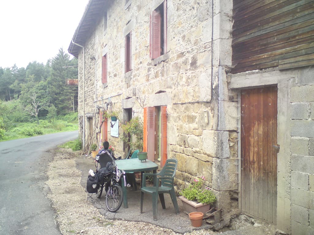 9.00am  The men eventually swapped driver and got the tractor moving.  One of them went inside with me and helped organise food with the large bearded woman who was peeling potatoes in a huge room in which whatever wasn't hanging from the ceiling was being chopped up on the table.<p>She seemed reluctant to make hot food and in the end I settled on bread, cheese and some sausisson.  Oh, and a glass of wine.<p>Later the man brought me out a large piece of apple pie too.  The sausisson had the strangest taste and the two cheeses might have had the power of self-locomotion, but I ate them before full scientific testing could begin.<p>The post-woman, who pulled up to deliver letters, looked at me strangely and said: are you eating? Is it alright?<p>When I came to pay the man had gone and the bearded lady asked for 11 euros, I, shocked, said surely there was some mistake and 3 euro would be fairer, in the end we settled on 3.5 euros.  I must say that's the first time I've ever haggled over the cost of breakfast. 