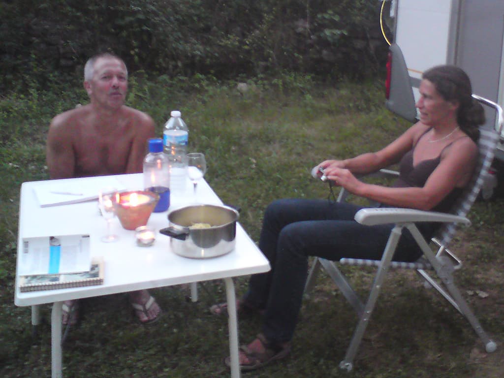 These were the lovely people I met after one them walked over and lent me a hammer when they saw me looking around for a stone to hammer in my tent pegs.  Elke &amp; Roland.<p>Actually, they also helped me make the fact that I'd been carrying an aluminium cup attached to my bike make sense.  They offered me a Pastis but only had two glasses, I dashed over to my pitch to return, triumphant, with the cup in question.<p>We spent a very pleasant couple of hours chatting and drinking, it turned out we had a lot in common.  It could just be that the pastis is the reason this photo is a bit blurry ;-)<p>Certainly the pastis, the sausages and chips with salad and ros&eacute; wine for dinner in the camp-site restaurant, helped eradicate any trace of tiredness in my legs. 