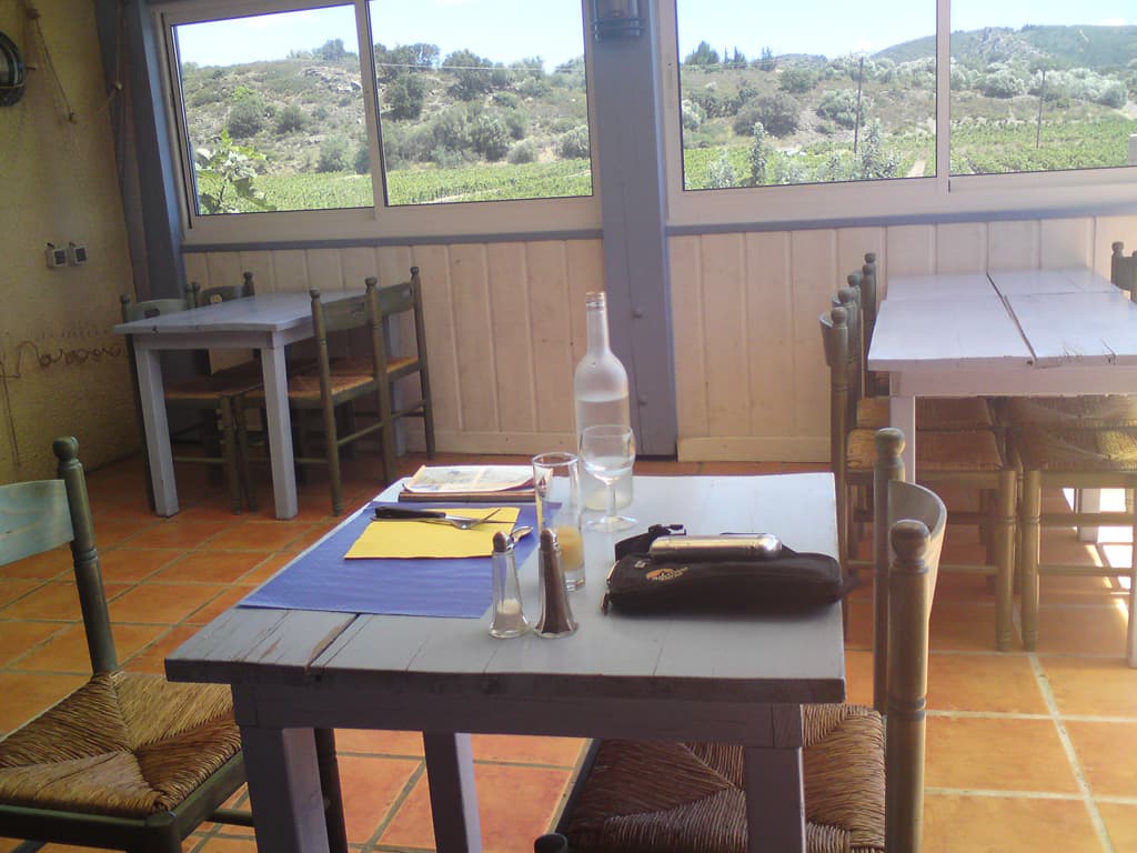 12.45am  I chose this little side room to have lunch, not the main restaurant, nor the terrace which was already fairly full.  Here, in this quiet haven I could gaze out at the mountains and the pool and read my book in between sips of cold water and cold wine. 