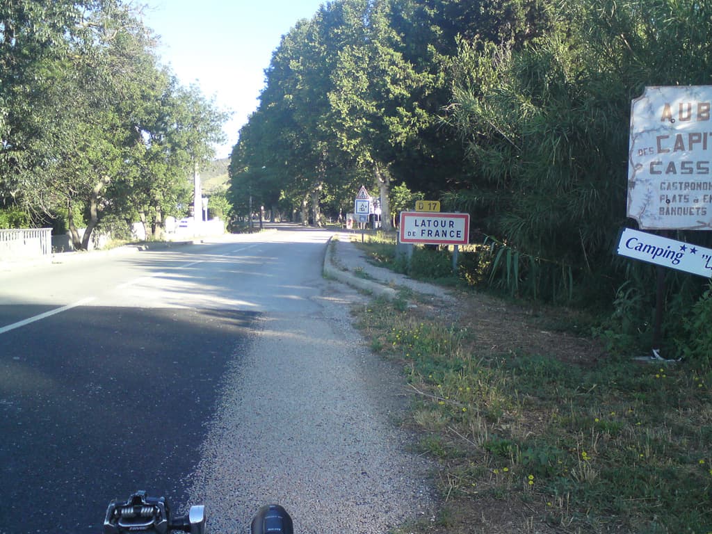 7.42am  I guess every cyclist must take this photo so that they can say they were in Latour de France.<p>The main thing I remember about the town, other than the steep climb out, was the old guy I spoke to who was working in his field on the way into town.  He spoke a happy mix of French, Catalan and Spanish - so it didn't phase him at all that I might slip in the occasional Spanish word.  When I mentioned his way of talking he said: Oui, c'est tout mezclanger - even the word a mixture of the spanish mezclar and the french melanger.<p>After 10 minutes of chat he signed off with: voy a travailler un poc; three languages in almost as many words.