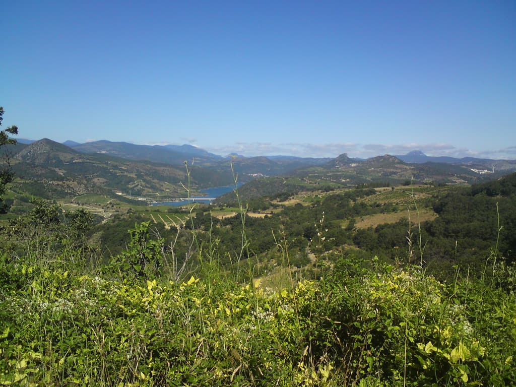 9.23am  Getting to the first high point of the day's ride.  In fact getting up to the high point had been a bit of a race.<p>For day's I'd been seeing lycra clad racers flashing about, sometimes flashing past me.  On this particular day I could a bright yellow jumper pedalling up the hill behind me and so I decided to just try a bit harder and make him work to overtake me.<p>I thought the top of the hill was closer than it was and so 15 minutes later I was till managing to keep him at bay though I was tiring.  Still worth the effort I thought.<p>So I kept pedalling, trying to get a bit more space between us on the short, occasional, dips in the road.  Eventually, very tired and sweaty I arrived first at the small village on the hill top where I had to stop to look at my map.<p>A few minutes later an old guy on a beat up mountain bike cycled up the hill with his shopping... wearing a bright yellow t-shirt.