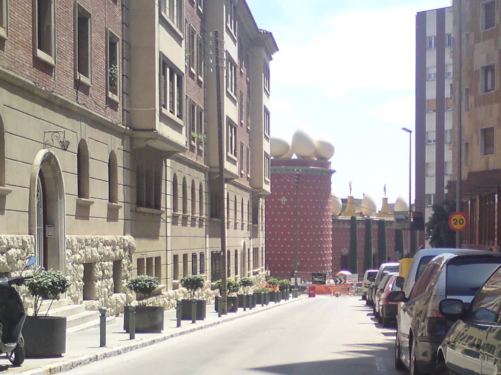 <p>12.32  The last 10km had been not so nice, unless I'd wanted to take a detour the only way into Figueres was by the side of the N2, a major trunk road.  Now although there was that nice little strip of tarmac the other side of the white line it was still noisy and unpleasant as large artics thundered by.</p><p>By now the heat was also moving on, inexorably, up the scale.  What had been a just bearable 32&deg;C was now nearer a melting 38&deg;C.  So, when I got to the tourist office to ask about campsites before cycling a way down the coast tomorrow I noticed a notice for the train station.  The timetable the girl in the tourist office gave me said there was a train to Barcelona and friends due to leave in 20 minutes.</p><p>I needed no further persuading, I was off.</p><p>I met a really nice guy in the train station, a cycling enthusiast who seemed to work there.  We chatted for a while about bikes and about recumbents when I noticed from the corner of my ear (is there such a place) that the train about to leave from platform 3 was the blah blah to Barcelona.</p><p>I suddenly realised I was on platform 2, I shouted to the guy I was talking to asking how to get to platform 3.  He told me but just said not to worry I wouldn't miss the train.  I just dashed off, pushing my bike over the tracks to get to platform 3 and was struggling to get my bike up the three feet between the height of the carriage and the platform when the guy I'd been chatting to walked by.</p><p>This time he was wearing his train person's hat and it was then I noticed his whistle and flag.  It seemed he was right, the train wasn't going without me - it wasn't going until he said it could!</p>rn<h4>The end, almost</h4>rn<p>I spent the next two weeks visiting friends in Barcelona and then Alicante and took the wonderful European Bike Express bus back from Rosas to England - after a day of exploring Rosas and environs on my bike of course.</p><p>A great trip, do yourself a favour, buy Paul Benjaminse's book and do it yourself.  He manages to choose the nicest, quietest routes all clearly mapped.  Next year I fancy doing the entire route from Amsterdam, though perhaps doing the Rhone valley variant for a change.</p>