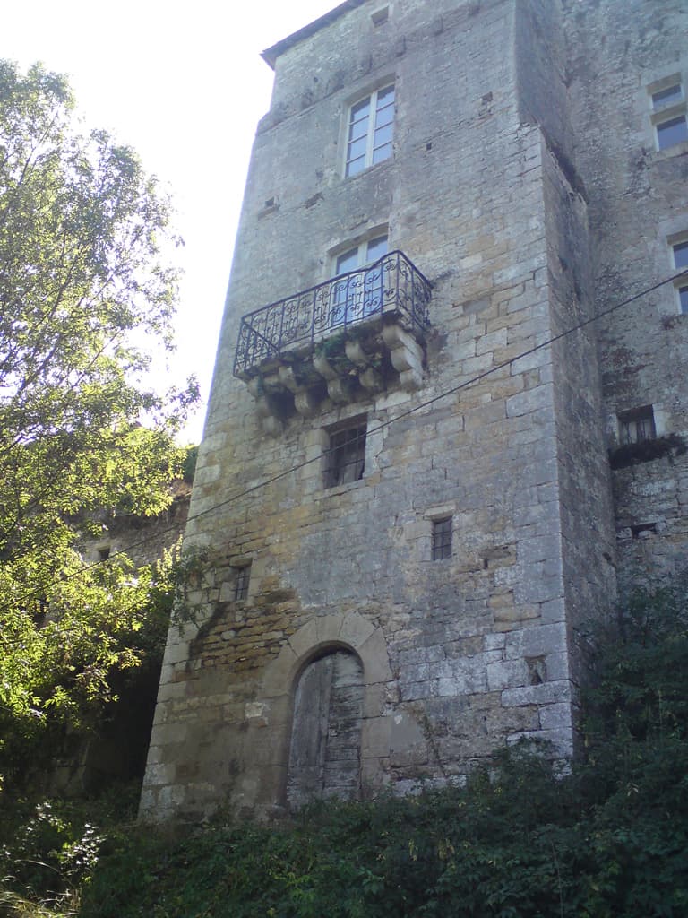 We'd passed a very nice house just a few moments before,
 with a terrace and a swimming pool overlooking the valley from the small promontory where it was shaded by trees on one side.<p>Zooming down the hill there was this place.  It was funny that almost every dwelling place we'd passed seemed to have been built in the 15th Century for some nobleman.  I mean look at this place!<p>At the bottom of the hill we turned over the bridge to come out at Corn.  Unfortunately the last few kilometers weren't as pleasant going back as they had been on the way out.  They were laying fresh tarmac and had sprinkled gravel over everything that they hadn't rolled in.  Consequently it was difficult to ride on and worrying whenever a car sped past in the opposite direction.  But we made it.