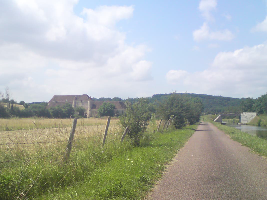 <p>I saw quite a number of houses with turrets, chateau cum farm house.&nbsp; Actually you can also see what were largely the only climbing and descending I did for a couple of day's, each time the towpath came to either a bridge or a lock it would rise slightly and dip the other side.&nbsp; It meant you'd slow from 20ish to 10 then speed up to 28 down the other side before settling back down to the 20ish again.&nbsp; Unfortunately this wasn't alway's possible.&nbsp; There were two problems with both this canal and the one 1000km to the south that I'd travel later:</p>rn<ol>rn<li>barriers placed too close together and so impossible to get a bike through (a bit of a design error on a cycle path!) and also placed, too frequently, at the bottom of the slope instead of the top so you lost the descent advantage;</li>rn<li>thick gravel placed around all the lock keepers' houses - very difficult, and dangerous, to cycle on.</li>rn</ol>