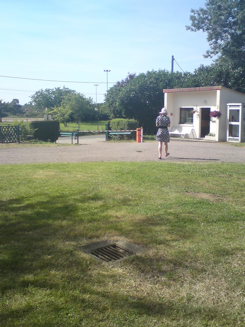 <p>Damn me but the nice french girl who'd helped me earlier in the post office turned out to be the municipal campsite worker.&nbsp; It seemed worthy of a photo, only in France does a campsite worker wear, not jeans and a tee-shirt, but a pretty dress with patent leather belt and a panama hat.</p>