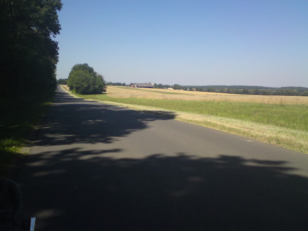 <p>It was getting warmer and warmer and along here I was cycling gingerly on the left of the road to remain in the shade.&nbsp; Not exactly a risky strategy since there are very, very, very few cars.</p>