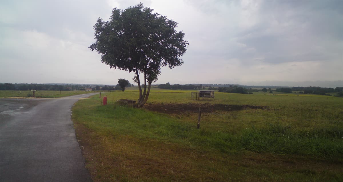 <p>Click on this photo to see a panorama, but I think even this smaller photo suggests the wider landscape that I'm in at the moment.&nbsp; It's getting more hilly and this means that when you crest a hill you can suddenly see a long way.&nbsp; It was still damp, as you can see, but nice riding.</p>