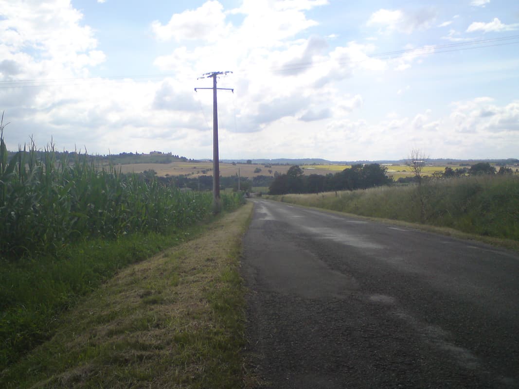 <p>I wish I could remember what the name of this town on the horizon is, I think it was Villebois-Lavalette.&nbsp; It was getting hillier and hotter again and I'd run out of water.&nbsp; The landscape is wide with big long hills, nice in descent but harder work getting up them, especially in the sun.</p><p>I got to the town but everything seemed closed, all except a small tabac in the centre, just opposite a nice looking chambre d'hote.&nbsp; I went in, looking hot and sweaty and asked, in my nicest French, if the lady might fill my water bottle for me.&nbsp;</p><p>She replied: 'no'.</p><p>I was stunned, I simply thanked her, wished a nice day, and left.&nbsp; I later found the tourist office, who were as nice as pie and filled my water bottle and gave me instructions about nearby campsites - that there were none in the direction I was going, at least for some distance.&nbsp; They were also amazed that anyone could be so rude and heartless.</p><p>Still, I suppose if you've never walked any distance, or travelled in any other way than in a car, you might not realise how important water is.&nbsp; It's probably a modern variant on 'let them eat cake'.</p>