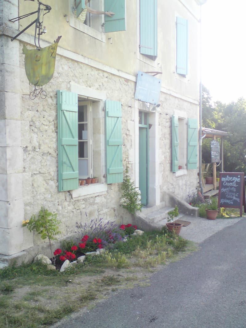 <p>Whilst there was no campsite nearby it turned out that there was an auberge.&nbsp; The woman running it was a bit miffed that the tourist office hadn't mentioned it to me.&nbsp; It was an old lock-keeper's house that she'd converted, it was still owned by the council but she had paid for the renovations and so had 18 years rent free.</p><p>There were two rooms with four beds in each and the more people who appeared the cheaper your share of the room became.&nbsp; Which basically meant you couldn't be sure to have the room to yourself and that put me off.&nbsp; Besides, I like my tent and I can be sure that I have that to my'self, insects permitting.</p><p>She also sold jams and various foodstuffs, and, on the wooden veranda you can see to the right of the building, you could eat.&nbsp; I had coffee and fresh orange juice as a treat, and as the cost of entry to the toilet of course.</p>