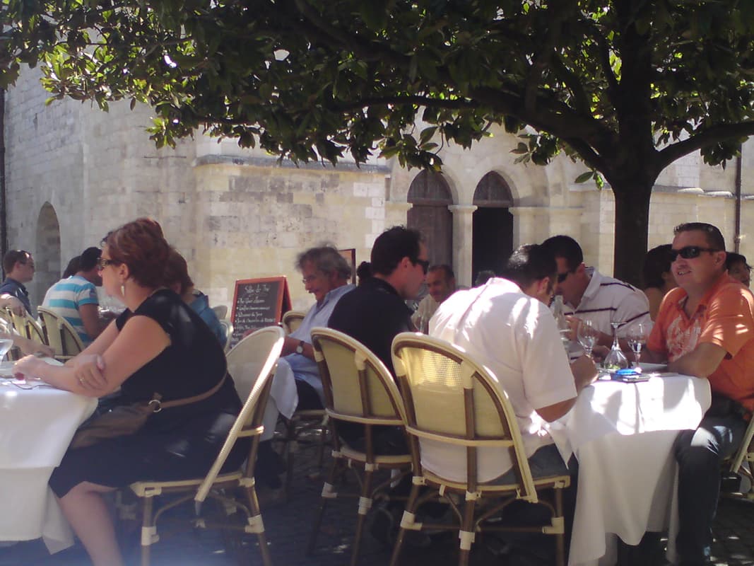 <p>The restaurant was very busy, with all the tables outside under the shade of this magnolia tree.&nbsp; I was lucky to get a table in the shade of the wall, looking out on the square.</p><p>I'd decided that today was a treat day and went for a 23&euro; menu with a glass of ros&eacute;.&nbsp; Boy was it worth it.</p>