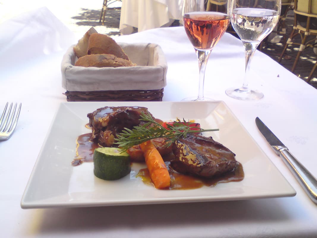 <p>The main course was duck, two pieces, one magret and the other confit.&nbsp; The herb leaf you see is actually carrot leaf, it had me puzzled, I'd not come across that before used as a garnish.&nbsp; Oh, and the bread was gorgeous too, light and fluffy in the centre with a very crispy crust, and very tasty.</p>