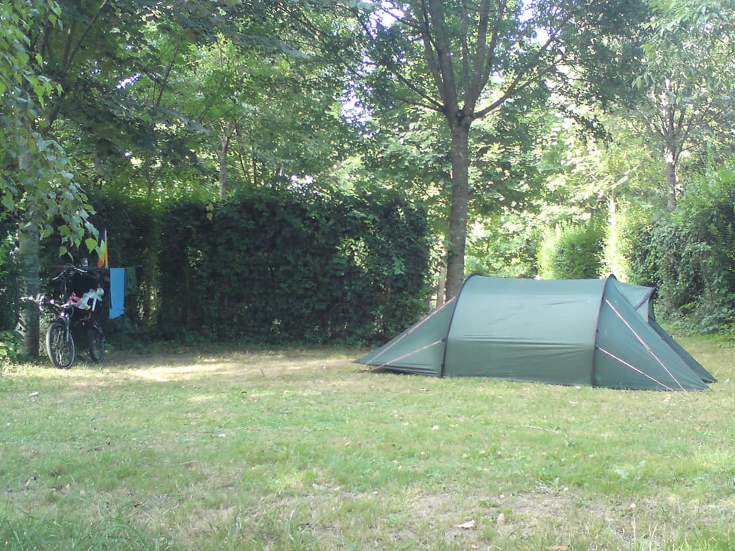 <p>Each of the emplacements were in a little protected square of hedges.&nbsp; On the other side there was a small river/canal, so it was very quiet.&nbsp; Rollover to see a view from of other direction, though you might need to hover your mouse over for a few seconds before the other image loads.</p><p>The next day I had as a rest day and went to explore Moissac.&nbsp; There was a market so I bought some peaches and cherries, the cherries were fantastic and cheap by comparison with England.&nbsp; I didn't bother with lunch but went back to the campsite and ended up sleeping for 3 hours.</p><p>I went back into town on the bike for dinner and listened to the sound check of a group that were going to play as the soundtrack for an animated film to be projected in front of the abbey.&nbsp; Unfortunately, it wasn't going to start until 10.00pm and I didn't have my lights and, inspite of my sleep, was still feeling tired, so I decided to just have dinner and miss the film.</p><p>The only cheaper place to eat was a pub, english stylee, where I had cassoulet and ros&eacute;, though it was still 19&euro;.</p><p>On the way back I chatted to a french couple touring with their bikes about their trailer and when I mentioned that I was going south they gave me a street plan of Toulouse, which proved very useful the next day.</p>