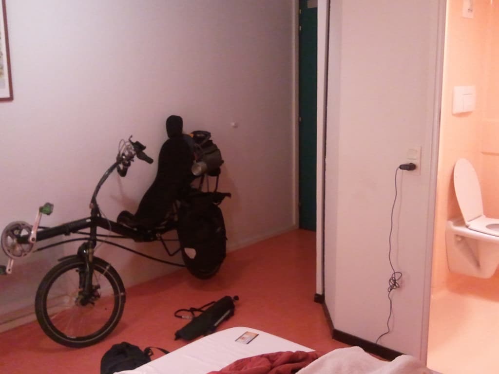 <p>I was going to arrive at midnight which was a bit too late to find somewhere to camp and too early to just have an early start so I'd booked in via the Internet with Premi&egrave;re Classe Hotel, Orl&egrave;ans. &nbsp;I'd emailed them to ask in my best French if I could have a ground floor room and take my bike in and they gave me this, fantastic room for the disabled. &nbsp;I don't know if they thought that's what I was with the recumbent bike but it worked out a treat.</p><p>Actually it worked out a treat once I got in the hotel. &nbsp;When I first arrived, after 17 hours on the coach, there was a dutch couple who couldn't get in since the large double gates were locked. &nbsp;You have to punch in a keycode which neither they nor I had. &nbsp;They left and I was wondering how to climb over the large wire fence when a french guy appeared. &nbsp;I explained the difficult and he pushed open the little side gate next to the large one... &nbsp;which I'd not even noticed</p><p><img title="Embarassed" src="./scripts/tiny_mce/plugins/emotions/img/smiley-embarassed.gif" border="0" alt="Embarassed" /></p>