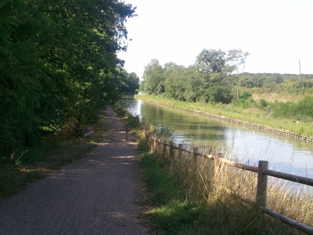 <p>This was a difficult choice, there was a nice quiet towpath to follow, but gravel and hardwork, or a busier main road which would have been easier cycling. &nbsp;I decided to go for slower and more peaceful in spite of my growing hunger.</p><p>I finally found a restaurant on my side of the river with my destination over a bridge on the other. &nbsp;9&euro; for tomato tarte and lettuce, tagliatelle with cream and tuna followed by fromage frais, and to help it go down, yes a ppr, petit pichet de ros&eacute;.</p><p>Feeling a lot better I cycled over the bridge to the campsite, which was actually on an island in the middle of the Loire, and it was closed until 2.00 and it was ten to; waited in the hot sun wishing the minutes to pass.</p><p>I finally got in and paid and sat on a bench and watched the shadow of some trees move before deciding which was the best pitch. &nbsp;I put the tent up but I was so, so tired; it was 35&deg;C in the shade so I slept until 7.00pm when I went to retrieve my Powermonkey which was on charge. &nbsp;Naturally. &nbsp;</p><p>Charging stuff was proving an ongoing problem: my gps had run out of power just before I arrived here and my phone too, so no photos of lovely Sancerre and the Ch&acirc;teau on the hill. &nbsp;No photos either of the lovely couple who'd showed me the cyclepath. &nbsp;I'd asked a very attractive older woman cycling home with a bit of shopping in a straw basket about where the cyclepath went and she explained and cycled on. &nbsp;When I got going and caught up with her it was just as she was getting off her bike to go into her house, one of those delightful, slightly delapidated affairs with wisteria or somesuch draped over a doorway and a garden bursting with flowers. &nbsp;I heard her say something and so I circled, slowed and stopped.</p><p>She was interested in the bike and called her husband to come and have a look too. &nbsp;He spotted my solar panel and so we all chatted for a little while about France, England, cycling in general, and recumbents in particular. &nbsp;Very nice. &nbsp;I love such chance meetings, and pleasant exchanges in foreign lands.</p>