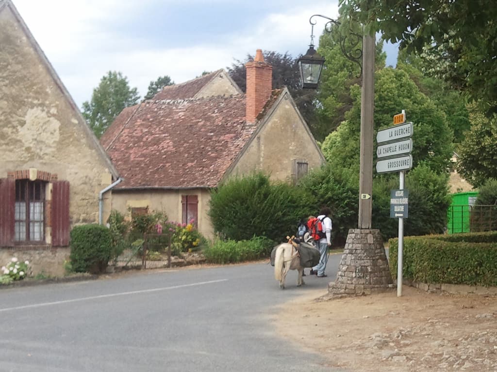 <p>Whilst looking at the menu in the Brasserie, which didn't seem at all bad, I'd met this couple, trio if you count the Shetland pony. &nbsp;I'm used to being on the most unusual form of transport but this couple definitely beat me. &nbsp;There were walking to Santiago de Compostela with a pony!</p><p>Anyway, enough of idle wandering and taking photos, on to the next village and the restaurant recommended to me, I'm starting to feel hungry even though it's only 11.15am.</p>