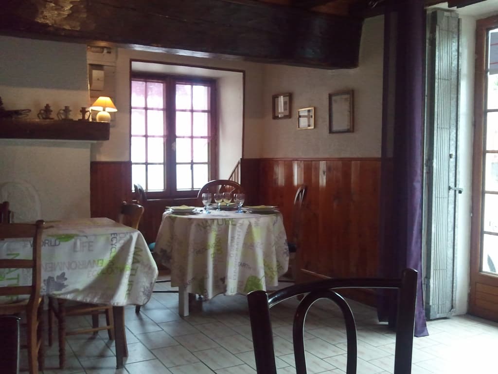 <p>Au Petit Chez Soi the restaurant is called on the D41 just as it leaves the village. &nbsp;An uninspiring exterior, nicely decorated inside and wonderful food that wasn't expensive.</p><p>OK, detail. &nbsp;I sat and had a demi-p&ecirc;che while browsing the menu waiting for the food to be ready since it was only just after 12.00. &nbsp;In the end I went for onion tart, magret of duck, and a ppr (petit pichet de ros&eacute;).</p><p>The first dish arrived: a huge tureen of soup. &nbsp;Not what I thought I'd ordered but it was very tasty so I served my'self four bowls of it from the tureen. &nbsp;Then a portion of onion tart arrived. &nbsp;Oops, the soup was just a 'get you started freebee'; perhaps I shouldn't have gorged my'self on it?</p><p>Next course, magret of duck with saut&eacute; potatoes and a wine sauce. &nbsp;Then a plate of cheeses but since by this time I'd finished the ppr and the proprietor was also concerned that ros&eacute; just wasn't the thing to drink with cheese he gave me a free petit pichet of red. &nbsp;Then the dessert, I chose fromage frais with honey. &nbsp;All that for 9&euro;!</p><p>I could barely cycle and whatever aerodynamic advantage a recumbent bike might have was rapidly being lost because of my pot-belly. &nbsp;Then it rained, cats &amp; dogs. &nbsp;Luckily I was wearing my swimming trunks as underwear (that chafing problem), since below the waist, below my waterproof in other words, I was soaked to the skin. &nbsp;It only lasted half an hour then it was scorching so very humid with steam coming off the road.</p>