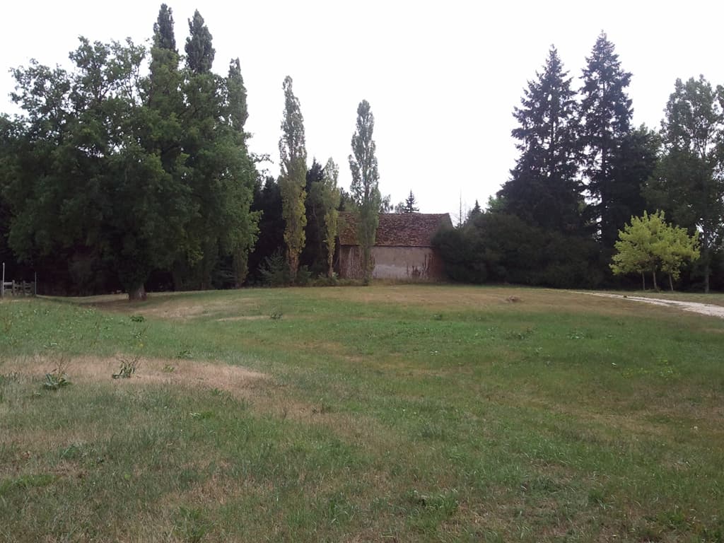 <p>The campsite at Mornay looked nice enough, I realised I'd cycled through there last year on the main road that thundered through the village, but the village didn't seem to have any shops, so I carried on another 8km to Le Veurdre.</p><p>A good decision, the campsite was a small municipal one, quiet and cheap. &nbsp;When I first arrived at the campsite there was no one there, so I did my usual thing of wandering around with my compass trying to figure out which pitch would be best given I prefer: not under trees since if it rains under a tree rains twice, trees or other shade to the west so it's cool in the afternoon, clear view to the east so the rising sun can wake me up. &nbsp;You rarely find that of course but that doesn't stop me from looking.</p><p>So, tent up, washing done and hanging to dry. &nbsp;In fact if you click this photo you'll see the view through those trees, from the fence where I'd hung my washing. &nbsp;Then the guardienne arrived and watched my things (and the powermonkey on charge) while I nipped into the village to buy fruit and rice pudding for supper.</p><p>Once set up I sat and read for while: 37&deg; le Matin, my french novel to help me resurrect the french learned 45 years previously. &nbsp;I was reading to the sound of rustling leaves &nbsp;with the hot sun coming through to my shady seat, hot but with a breeze. &nbsp;Perfect.</p><p>There was an orange weather warning and it pee'd it down with rain later that evening and I thought, because of that, that the group of youngsters that the guardienne had said would arrive later weren't coming. &nbsp;No such luck, they arrived at 10.30pm and were noisy enough to make me wonder about getting out from my nice warm sleeping bag to complain. &nbsp;In the end I just put in my earplugs and went back to sleep.</p>