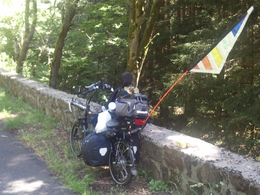 <p>Another drink/food stop, a pretty place to eat semolina pudding I must say.</p><p>It would take me 3 hours to final hoist my'self up to St Germain l'Herm and then, just after it there was a 25km steep descent. &nbsp;Lots of fun but I couldn't help think of the damn height I was losing since I knew that my next destination, La Chaise Dieu, was also at the same height, 1050m. &nbsp;Still, don't think about the road to come, just enjoy the moment; that's the way to do it, to quote Sootie, or was it Sweep?</p>
