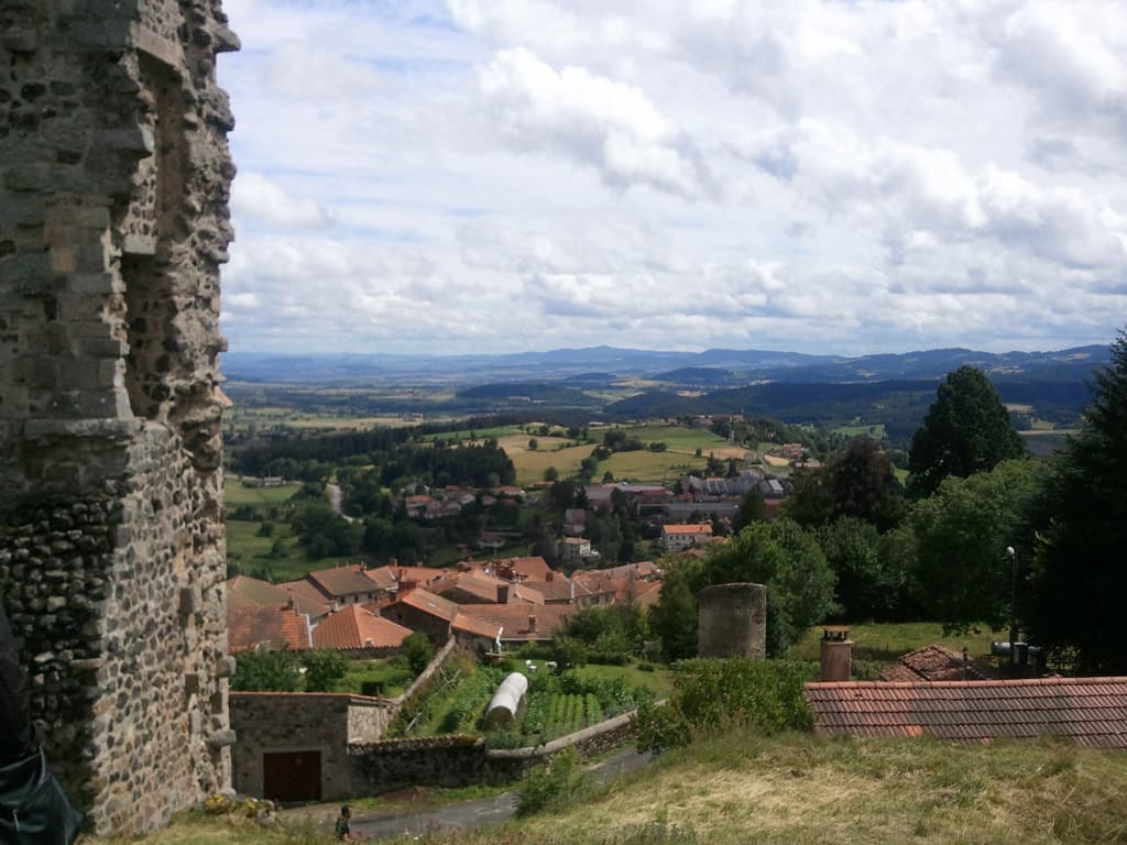 <p><strong>Sunday, 17th July</strong></p><p>On Saturday evening we'd all met up to go to a 'Banquet' in the village centre. &nbsp;14&euro; and not really enough food, there was terrine, aubergine flan and then pork cheeks (which were very tasty).</p><p>It was good company though and I got to meet some of the other recumbent riders who'd come for the week. &nbsp;Fond farewells were bid, since I was planning on leaving the next day, Sunday. &nbsp;However, it rained, all night and was still raining heavily the next morning too, so I decided to stay put. &nbsp;In fact I wrote these notes at midday on Sunday in my sleeping bag since it was cold. &nbsp;</p><p>A pity about the rain, not because I couldn't leave, I was happy to stay, but because it had spoiled some of the celebrations scheduled for the Sunday.</p><p>This was taken on Sunday afternoon.&nbsp; In the centre of All&egrave;gre, was this ruin, from the top of which you have magnificent panoramic views of the surrounding country'side. &nbsp;</p><p>By the way, if you're interested in knowing more about All&egrave;gre and the region here's a <a href="http://www.france-hpv.org/rando/allegre2002/guide_semaine_vph_2003_web.pdf">link to a guide.</a></p><p>I must say, if you're at all interested in human power and/or recumbents, you really should try to make it to the next VPH festival, I had such a good time, everyone I met was great company, was incredibly helpful and were lovely people.</p>