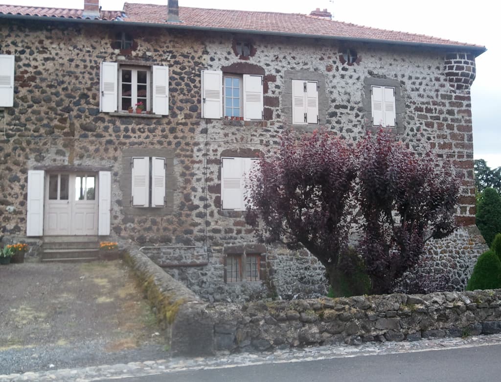 <p>At little village called Bains. &nbsp;I took the photo because of the house, modernised somewhat but notice the remnants of turrets at the top right corner of the house and the buttress type widening at the bottom right corner.</p><p>I'd stopped here to buy something at the bakers, and also to ask if I could use the toilet, but I was told there was a previous one, two toilets available one was hideous and the other merely nasty.</p>