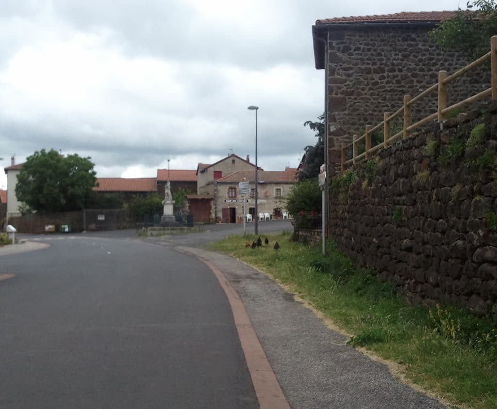 <p>Another quiet little corner. &nbsp;Those pedestrians are chickens.</p><p>Actually, at some point around here, before Le Bourg, Cayres I met a group of four French cycle tourists, two men and two women. &nbsp;The women were convinced that a recumbent was a good idea, especially since one of them suffered with a pains in the backside on her ordinary bike. &nbsp;The men were less convinced, mainly because they climbed faster than I did, the fact that on every flat and downhill I wizzed passed them, stayed sitting on my bike to chat though they alway's got off to stretch seemed not to matter.</p><p>At Le Bourg our routes diverged as they went towards Costaros, I think it was, where there was a market, besides they wanted to stay high and I was going to drop down after Langogne to head towards the Med. &nbsp;Happy trails.</p>