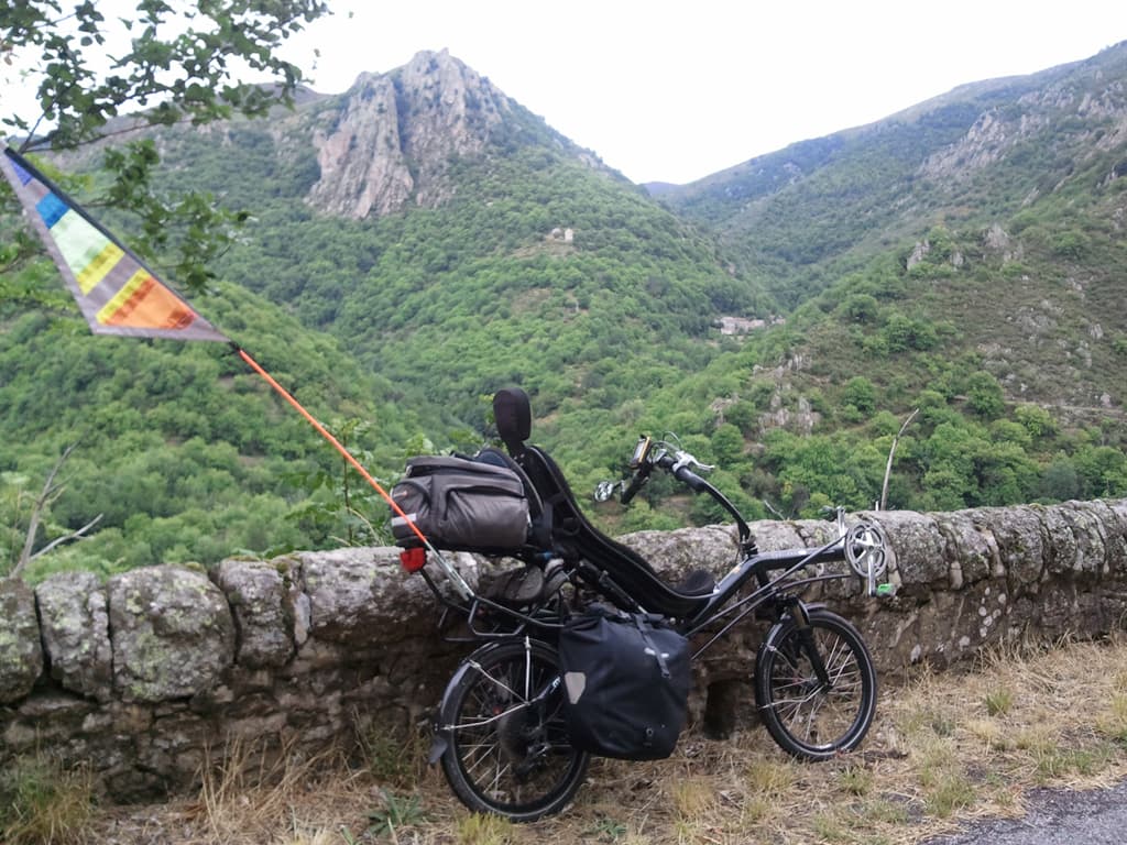 <p>You get some notion of the wild nature of the country'side in this photo. &nbsp;If you click to see the larger image you can make out a small village nestled in the hills opposite. &nbsp;When I stop, other than the sound of the wind in the trees it's utterly silent, a dense silence that makes you want to whisper.</p>