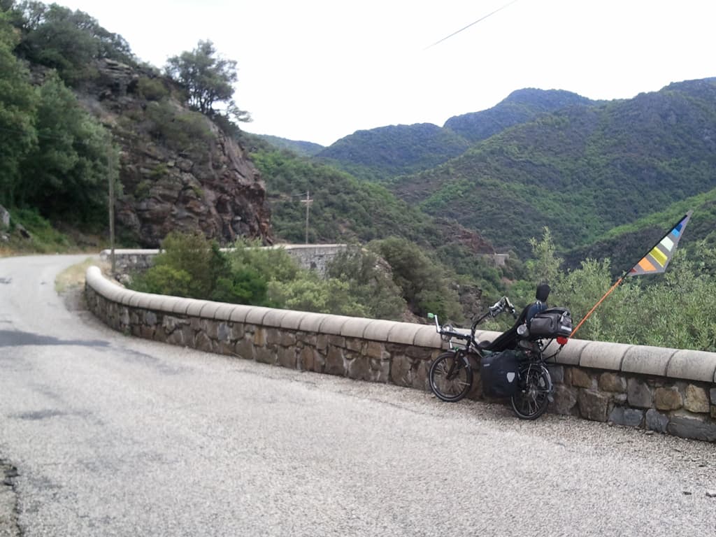 <p>At St Marguerite-Lafig&egrave;re you change sides, swapping the D151 for the D113. &nbsp;After a short rise it's curvy descents again with this low wall protecting you from dropping into the steep sided valley now on the right.</p>