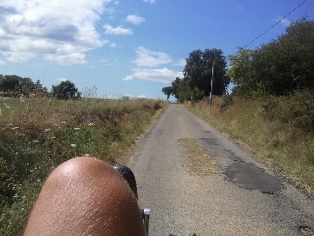 <p>You'll have seen my foot peeking in from the bottom of photos before, it's one of those things about taking a photo from a recumbent bike, in this one the photo is jazzed up by a tantalising glimpse of my knee.</p><p>Not sure where I am exactly, such a pity that the gps in the phone seems so erratic, damn Samsung Wave, I was really looking forwards to being able to pinpoint exactly where the photos were taken. &nbsp;I do know that I'm probably on my way to St Ambroix, don't think I'm passed there yet.</p>