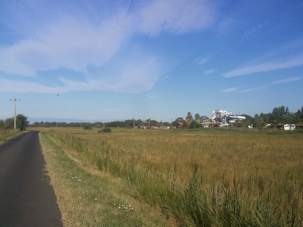 <p>Vias is full of campsites in what is a very flat, perhaps slightly marshy area. &nbsp;On the left here is some sort of entertainment park too, definitely the touristy end of camping.</p><p>I'd found the right way this time and was cruising along heading for the Canal du Midi.</p>
