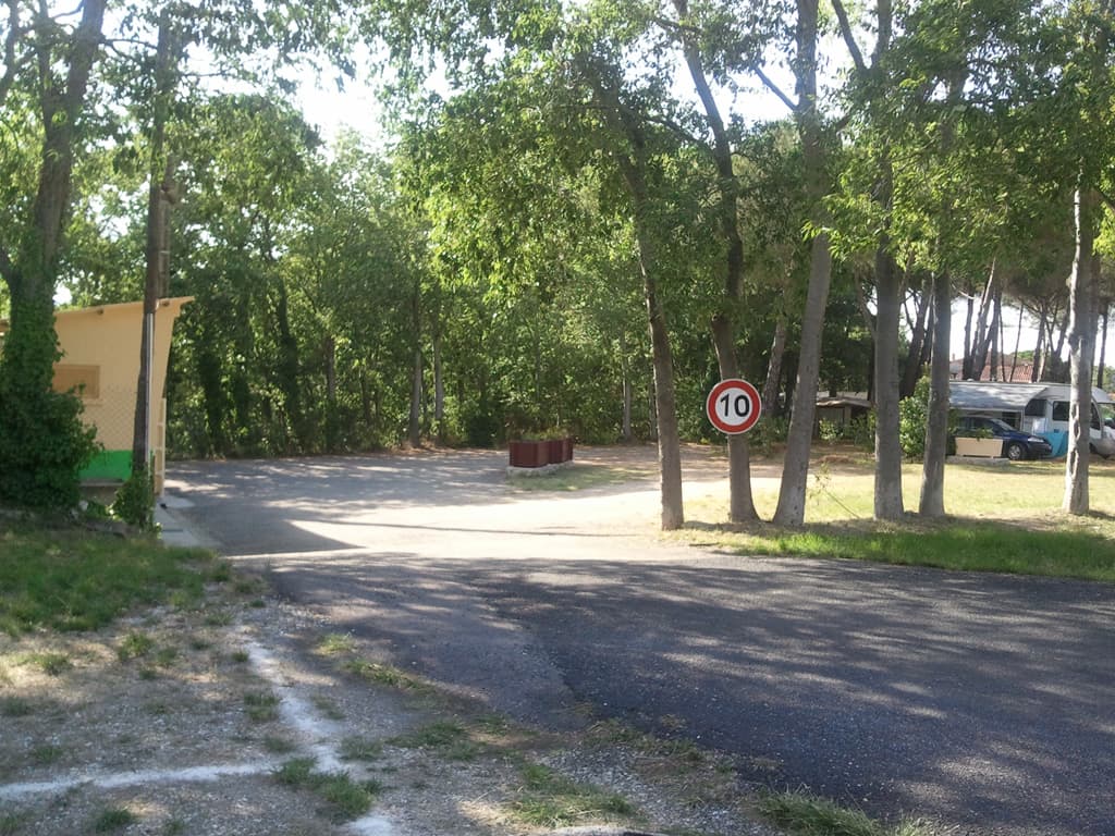 <p>I got the tent up. &nbsp;I had originally thought I'd put it up in a nice shady spot next to another tent which had a dog, which wouldn't stop barking. &nbsp;So, I went over to ask the owner if it might help if I greeted the dog, he thought it would. &nbsp;However, the dog made it clear that if I came any closer he was going to eat me, no doubt about it. &nbsp;So, I chose this quiet spot where I had no neighbours at all, and I had a fence to which I could fasten the bike.</p><p>Chores done I wondered into town since the warden wasn't around to pay. &nbsp;It was the towns saint day and there was a band playing and people were dancing sardanas. Click to see a <a rel="shadowbox;height=495;width=540;flashParams={allowfullscreen:false;quality:best;};flashVars={ containerwidth:540; containerheight:495; content:sardana.mp4; autostart=true; autohide:true; smoothing:true; showstartscreen:false; }" href="images/28/sardana/media/sardana.mp4">short video of that</a>.  By the way it can take a little while to load so don't be surprised if you see a blank black square for a while.</p><p>At 6.00pm I wondered back up to the campsite since that was the time the guardian was meant to show up. &nbsp;However, he, Laurence, didn't show up until 6.45. &nbsp;He turned out to be a really nice guy, put all my stuff on to charge and then we ended up in conversation. &nbsp;He was ex-army and finding the transition from a job that gave him lots of responsibility to being a campsite guardian a bit difficult.</p><p>If you click on this picture there is a different view back down into the campsite.</p>