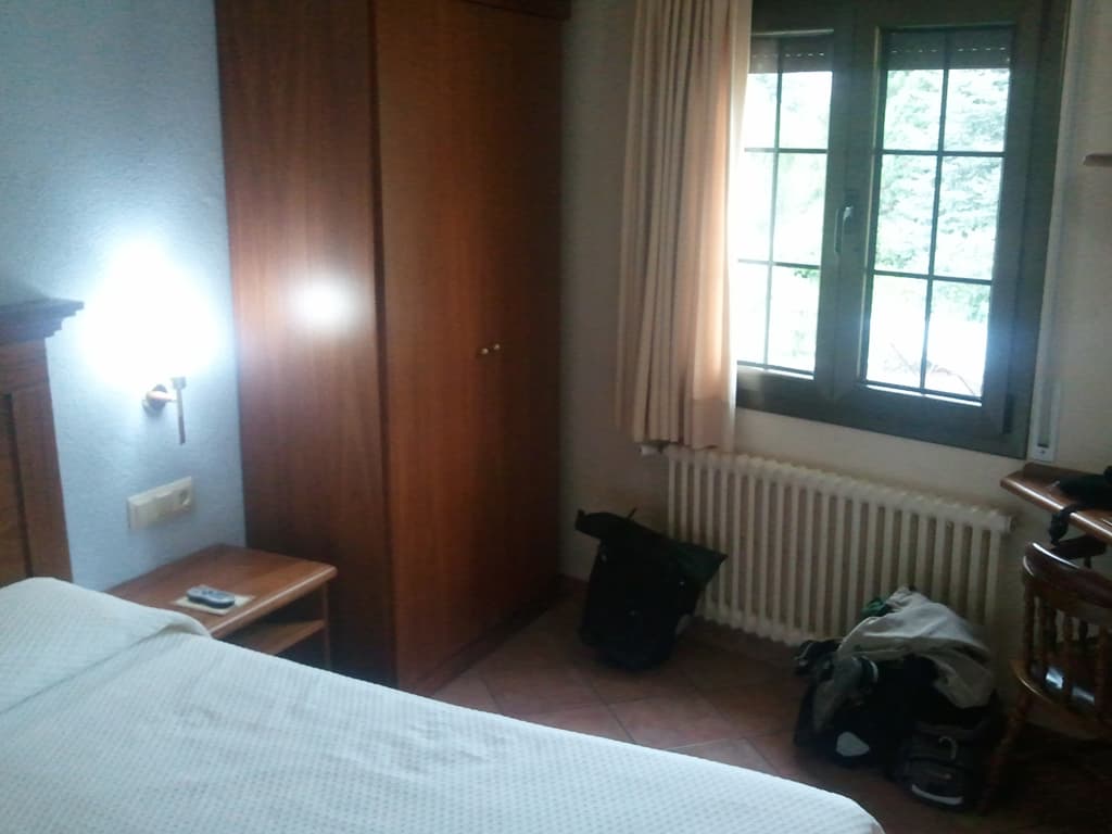 <p>The hotel, La Cuadra, was fantastic. &nbsp;Very nice rooms, lovely food, extremely friendly people and a pleasant little village. &nbsp;There was a municipal swimming pool but it rained largely for the three day's I was there so I didn't use it.</p><p>If you hover over this photo my room, you'll see a blurry photo of a bit of the breakfast buffet table groaning with food. &nbsp;I used to have bread with oil, garlic and tomato (Pa amb tom&agrave;quet) with some fuet, ham and blue cheese, followed by fruit then cake and coffee! &nbsp;Included in the price of the room.</p>