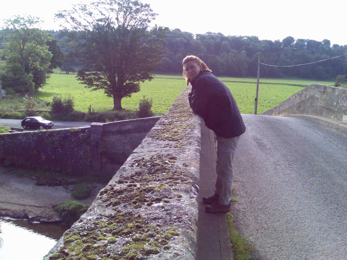 We needed, or so I thought looking at the map, to walk beneath this bridge to go west.  Pips takes her time before starting to gaze at the water.